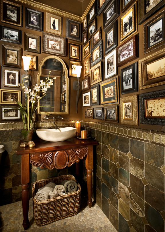 Inspiration for a mediterranean powder room in Denver with slate.