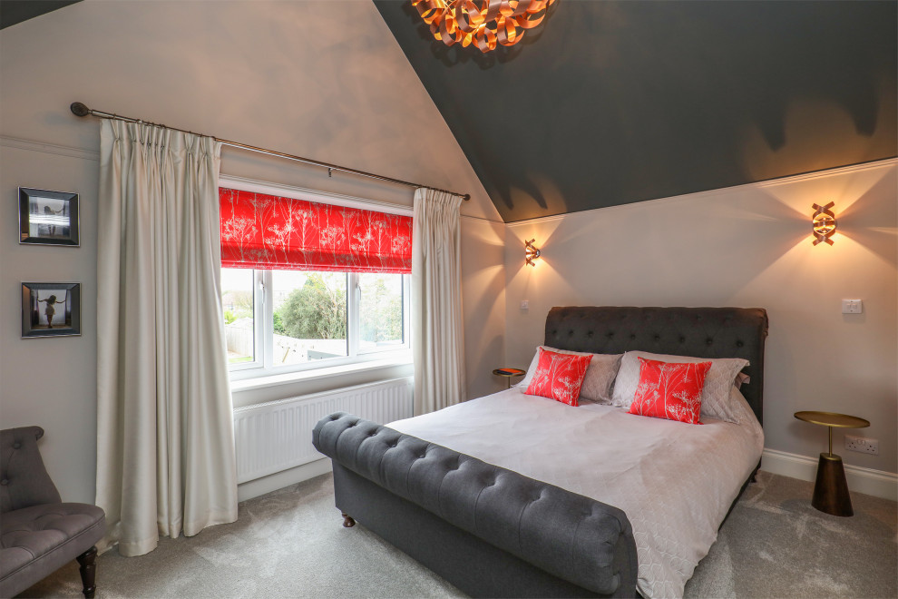 This is an example of a mid-sized transitional master bedroom in Other with white walls, carpet and grey floor.
