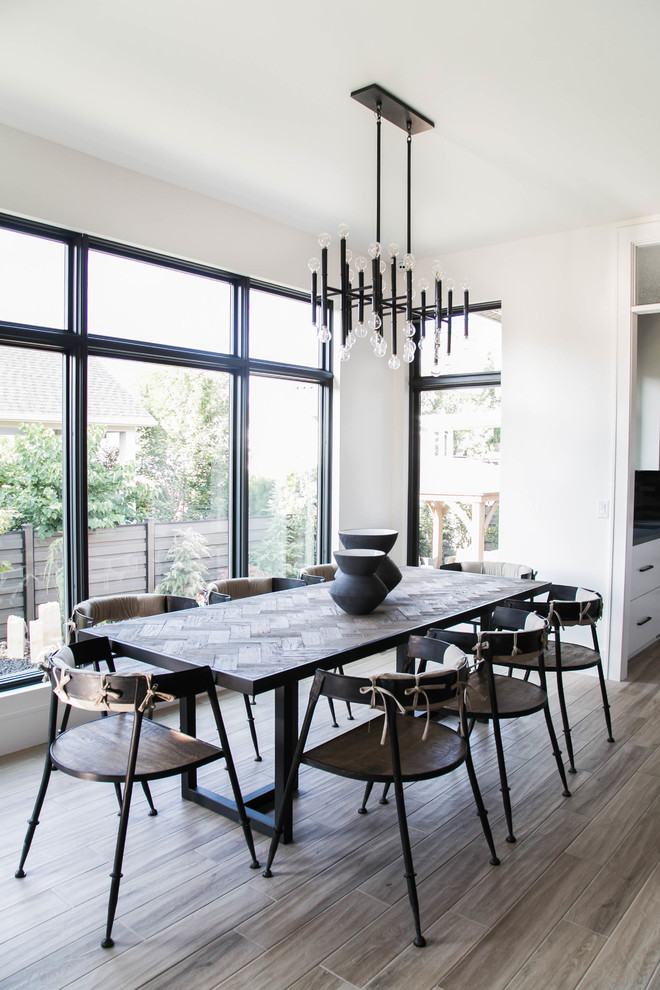 Design ideas for a contemporary dining room in Salt Lake City with white walls and grey floor.