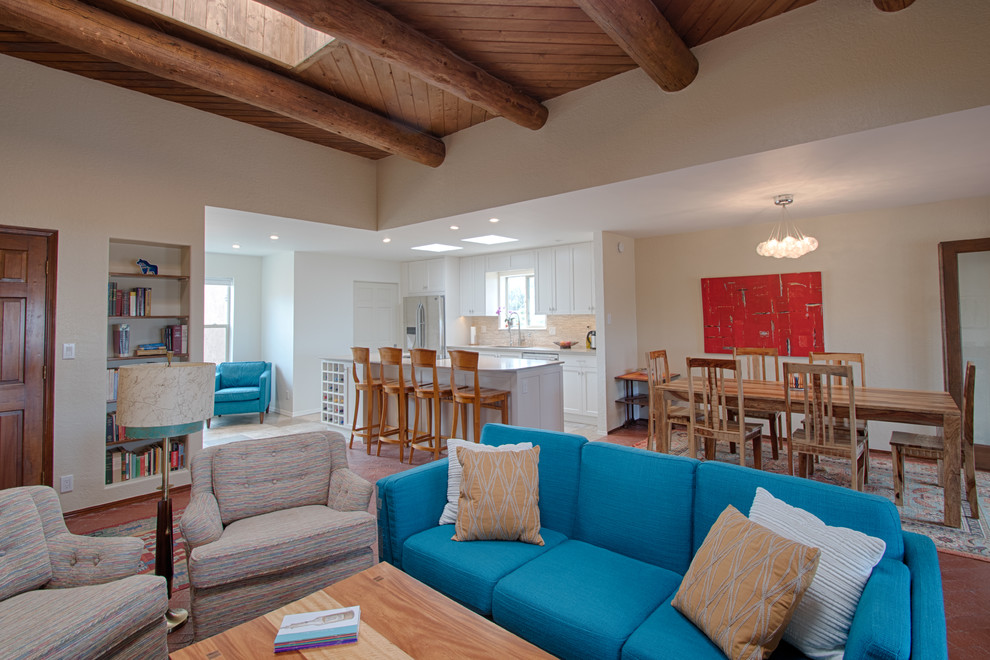 Inspiration for a mid-sized transitional l-shaped porcelain tile and beige floor eat-in kitchen remodel in Albuquerque with an undermount sink, shaker cabinets, white cabinets, quartzite countertops, beige backsplash, stone tile backsplash, stainless steel appliances, an island and beige countertops