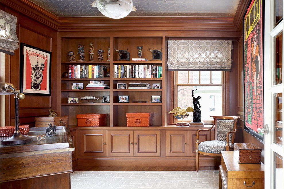 Home Office - Wood paneling creates a powerful feel in this home office. Custom cabinetry and book shelving add an efficient use of space for storage and displaying personal items.  Photography by Peter Rymwid.