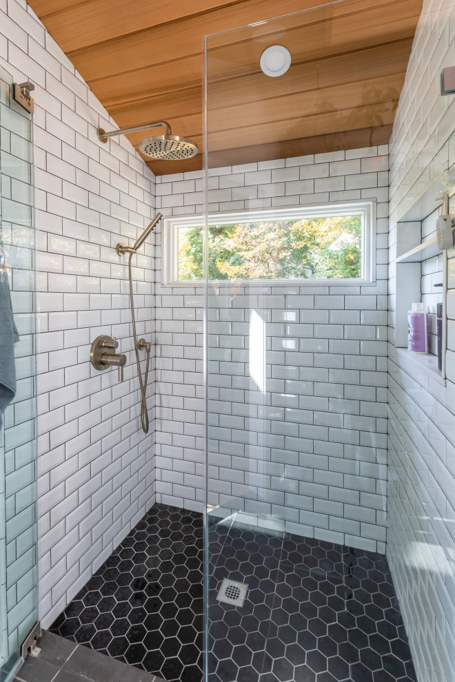 Photo of a large midcentury master bathroom in New York with flat-panel cabinets, dark wood cabinets, an alcove shower, a two-piece toilet, white tile, subway tile, grey walls, porcelain floors, an undermount sink, engineered quartz benchtops, grey floor, a hinged shower door, white benchtops, an enclosed toilet, a single vanity, a built-in vanity and wood.