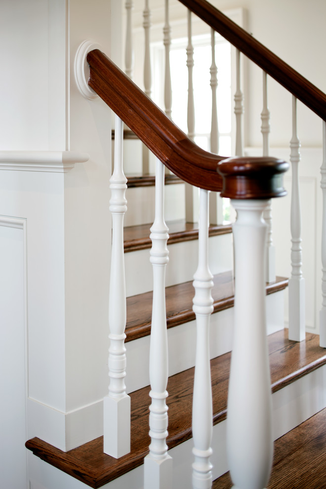 Inspiration for a mid-sized beach style wood staircase in Boston with painted wood risers.
