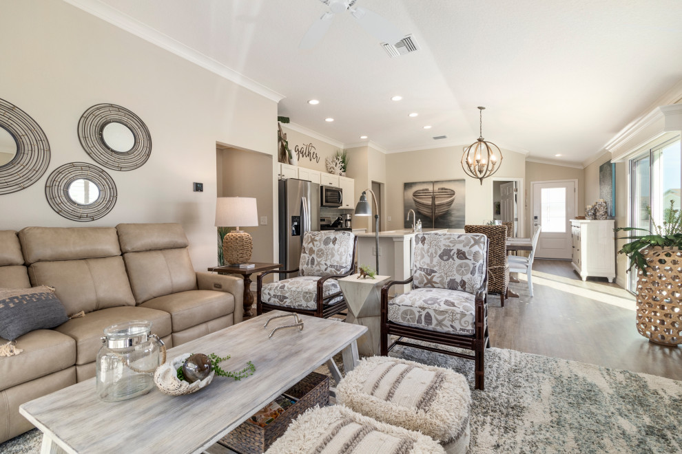 Photo of a mid-sized beach style open concept family room in Orlando with vinyl floors.
