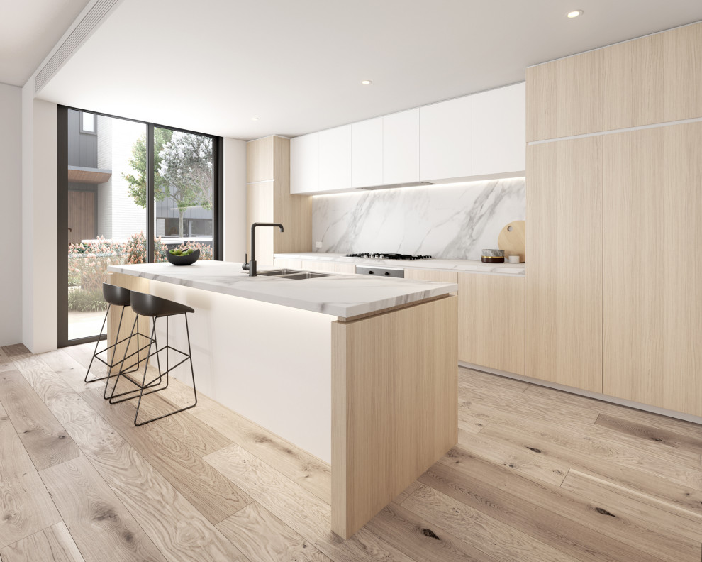 Design ideas for a large contemporary galley open plan kitchen in Melbourne with a double-bowl sink, recessed-panel cabinets, tile benchtops, porcelain splashback, black appliances, light hardwood floors, with island, white splashback and white benchtop.