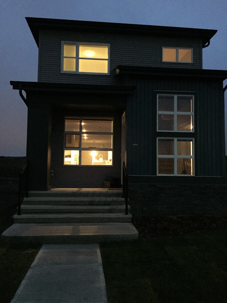Example of a transitional exterior home design in Calgary