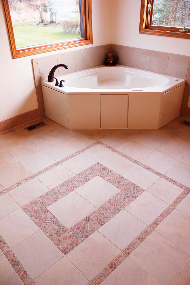 Large transitional master corner bathtub photo with white walls