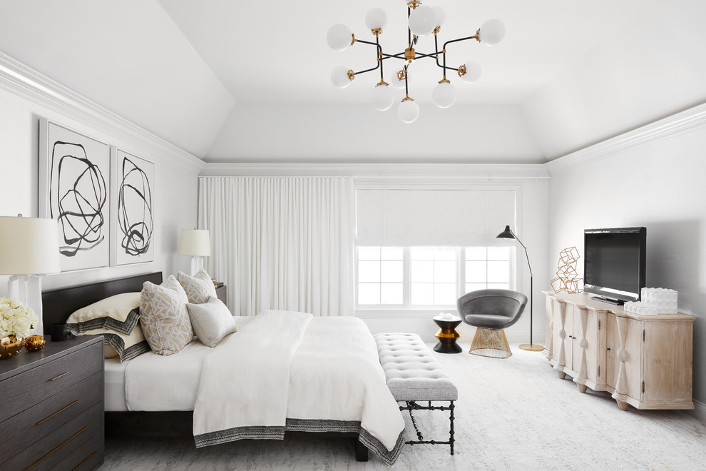 This is an example of a contemporary master bedroom in Chicago with white walls, carpet and grey floor.