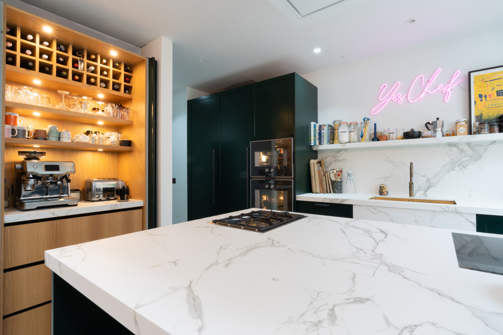 Inspiration for a medium sized traditional kitchen/diner in London with shaker cabinets, green cabinets, composite countertops, coloured appliances, an island and white worktops.