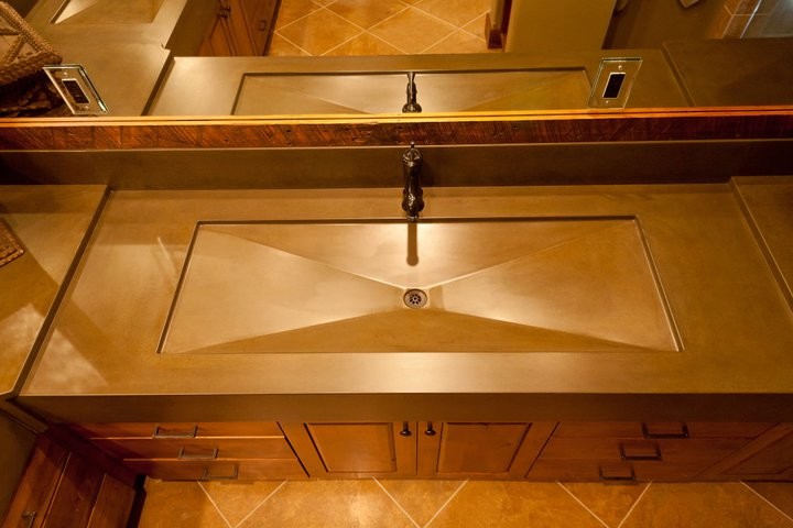 Large transitional master beige tile and stone tile drop-in bathtub photo with an integrated sink and concrete countertops
