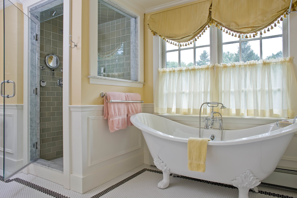 Traditional bathroom in Boston with a claw-foot tub, a one-piece toilet, white tile, mosaic tile floors and with a sauna.