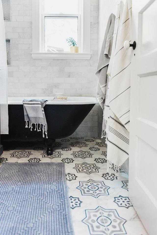 Photo of a mid-sized mediterranean 3/4 bathroom in Orlando with a freestanding tub, a shower/bathtub combo, subway tile, white walls, multi-coloured floor, a shower curtain, multi-coloured tile and porcelain floors.