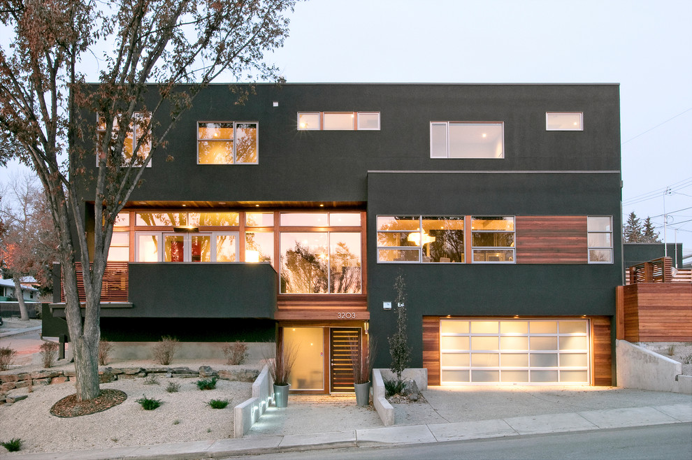 Inspiration for a modern two-storey exterior in Calgary.