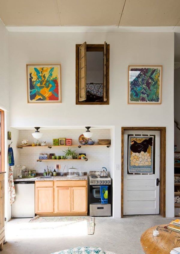 Example of a small eclectic single-wall open concept kitchen design in Albuquerque with light wood cabinets and no island