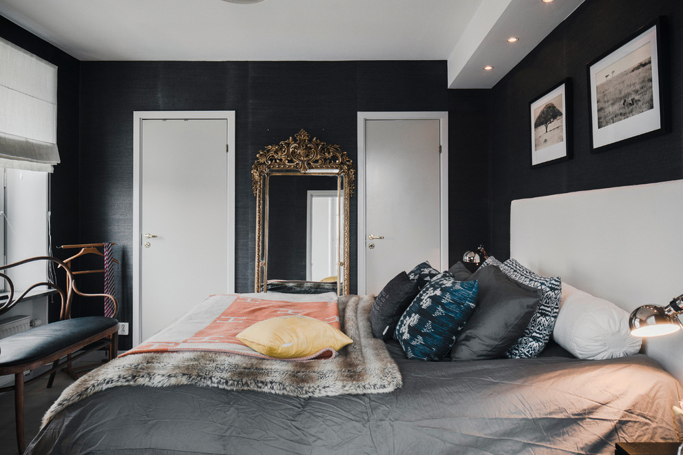 Mid-sized contemporary master bedroom in Stockholm with black walls and no fireplace.
