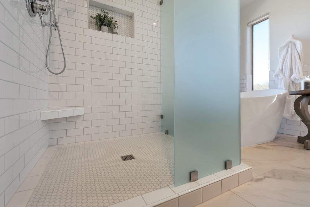 Mid-sized transitional master bathroom in Phoenix with a freestanding tub, a corner shower, white tile, subway tile, porcelain floors, white floor and a hinged shower door.