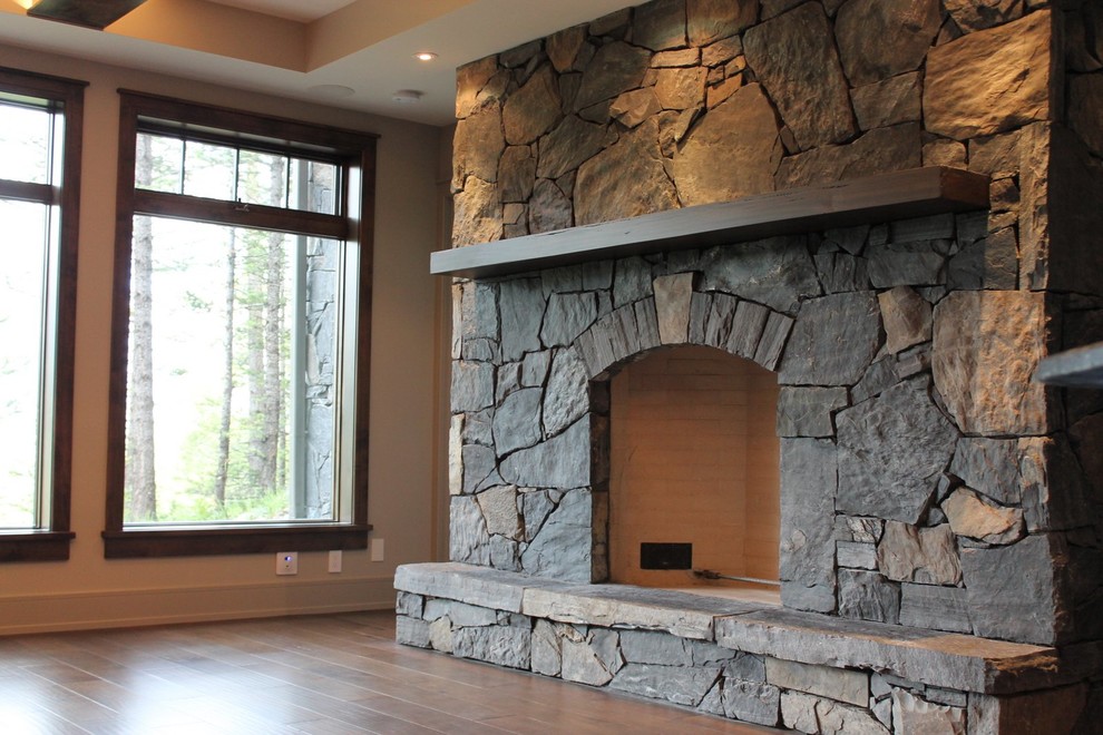 Example of a transitional home design design in Calgary