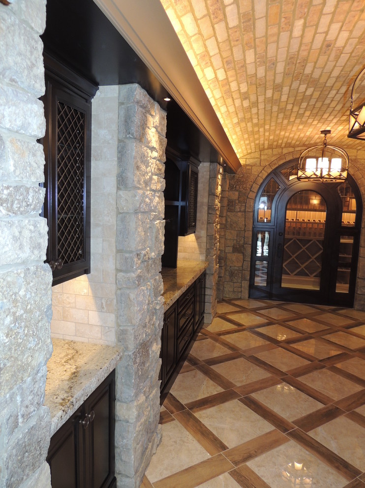 This is an example of an expansive arts and crafts wine cellar in Other with marble floors, storage racks and multi-coloured floor.