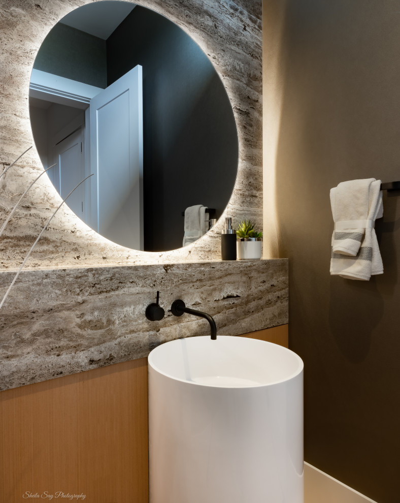 Medium sized contemporary cloakroom in Vancouver with flat-panel cabinets, light wood cabinets, a wall mounted toilet, grey tiles, marble tiles, a pedestal sink, travertine worktops, beige worktops and a freestanding vanity unit.