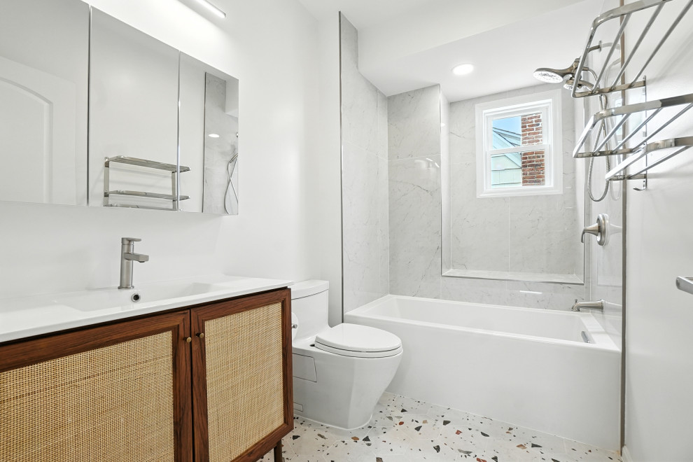 Bathroom with Cane Vanity and Terrazzo Floor