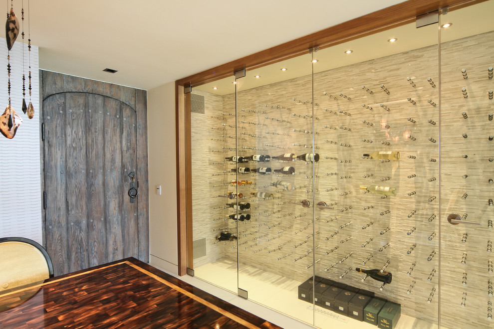 Photo of a mid-sized modern wine cellar in Vancouver with display racks.