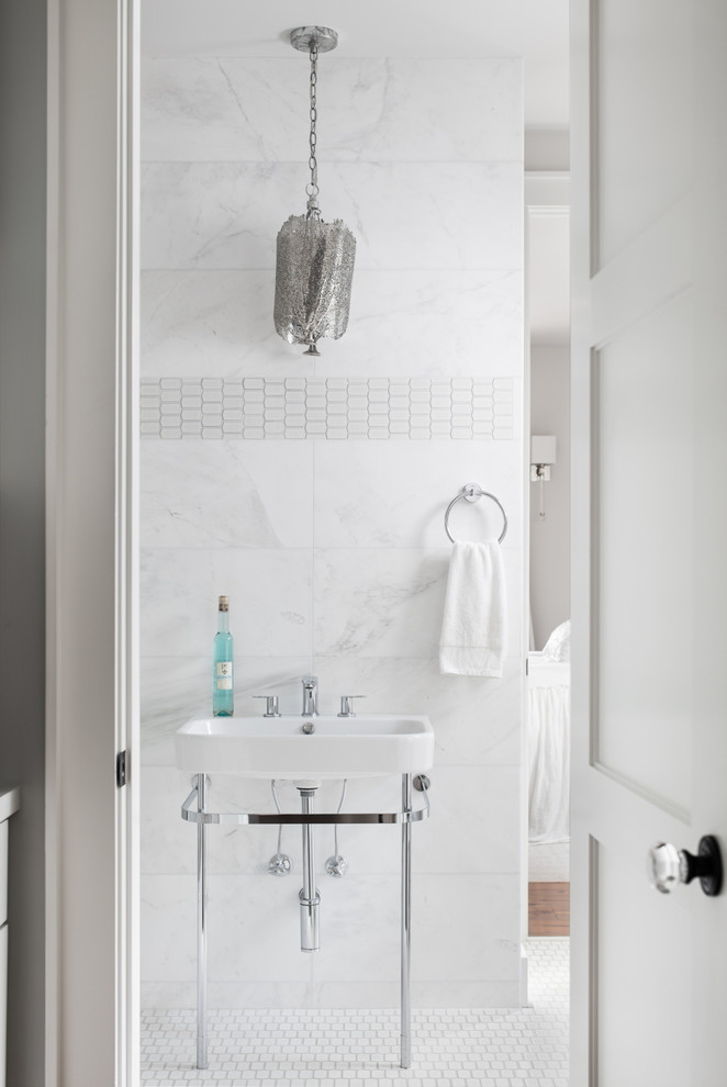 Inspiration for a mid-sized transitional 3/4 bathroom in Birmingham with recessed-panel cabinets, white cabinets, an alcove tub, a shower/bathtub combo, a two-piece toilet, gray tile, marble, grey walls, medium hardwood floors, a pedestal sink, granite benchtops, beige floor and a hinged shower door.