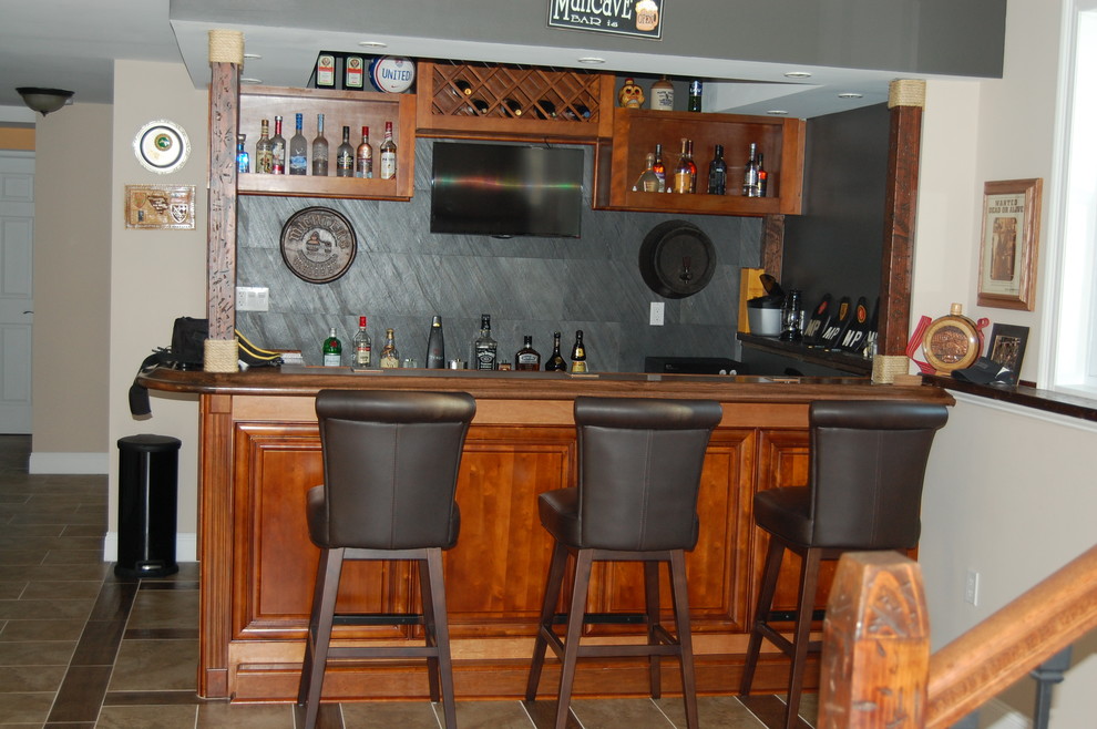 Inspiration for a large rustic walk-out porcelain tile basement remodel with gray walls