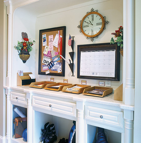 Design ideas for a mid-sized traditional mudroom in Nashville with white walls.