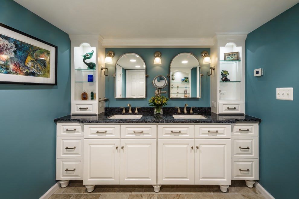 This is an example of a large traditional master bathroom in DC Metro with an undermount sink, beaded inset cabinets, white cabinets, granite benchtops, a corner shower, a two-piece toilet, white tile, ceramic tile, blue walls and ceramic floors.