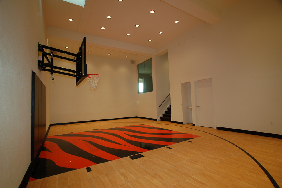 Inspiration for an expansive contemporary indoor sport court in Milwaukee with white walls.