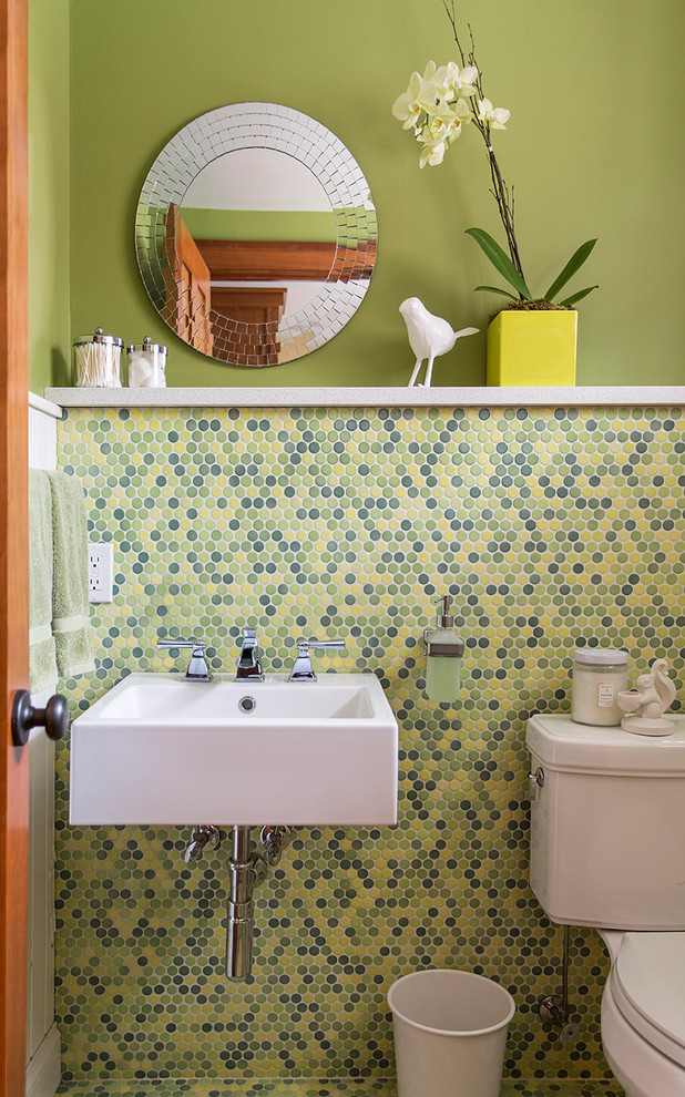 Inspiration for a small contemporary powder room in Minneapolis with a wall-mount sink, a two-piece toilet, multi-coloured tile, mosaic tile, green walls and mosaic tile floors.