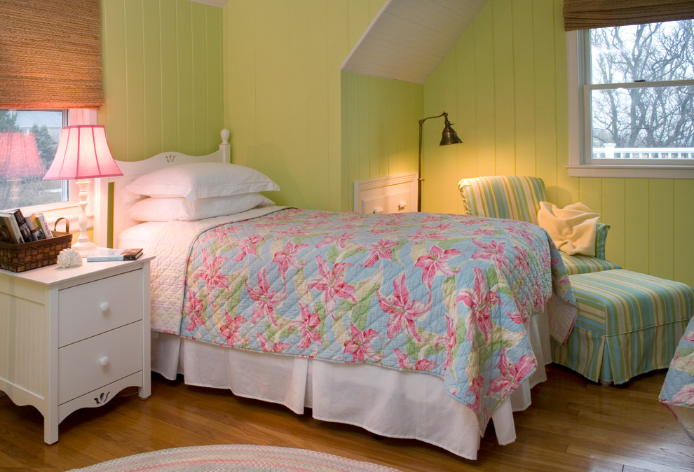 Traditional bedroom in Boston with green walls and medium hardwood floors.