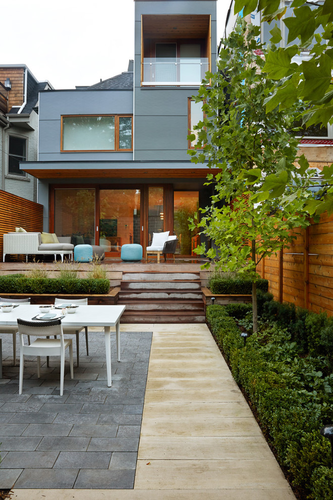Inspiration for a contemporary deck in Toronto with a roof extension.