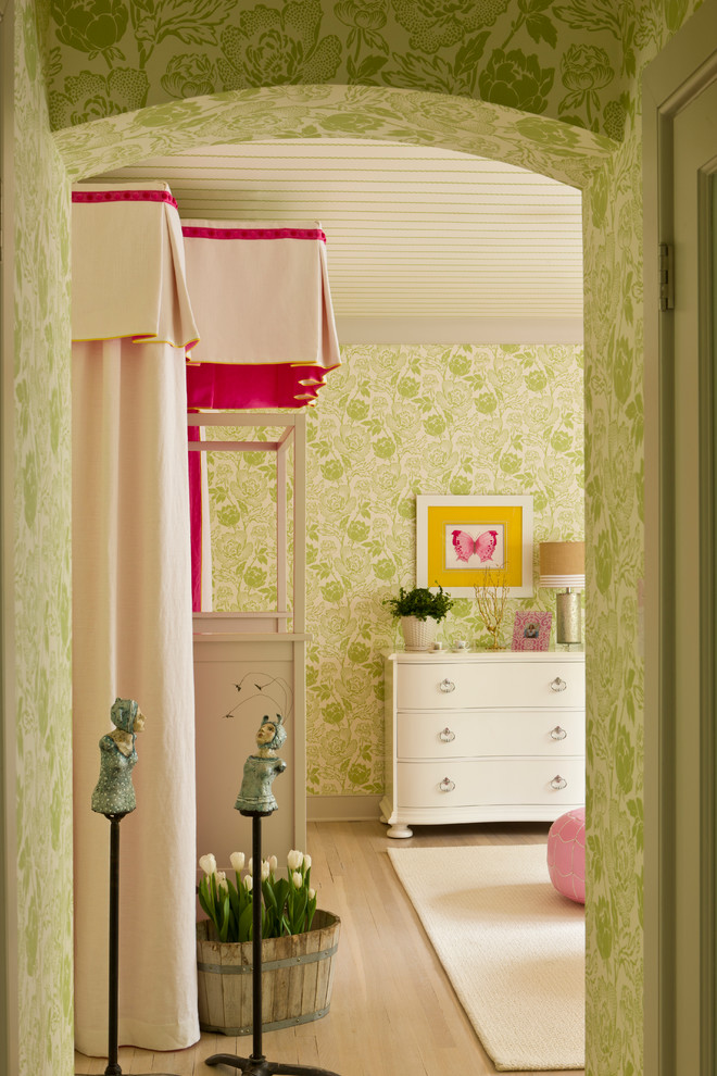 Photo of a transitional kids' room in DC Metro with light hardwood floors and multi-coloured walls.