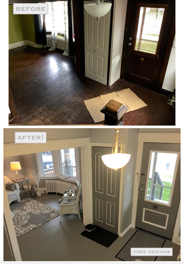 Large transitional painted wood floor foyer photo in Toronto with gray walls and a gray front door