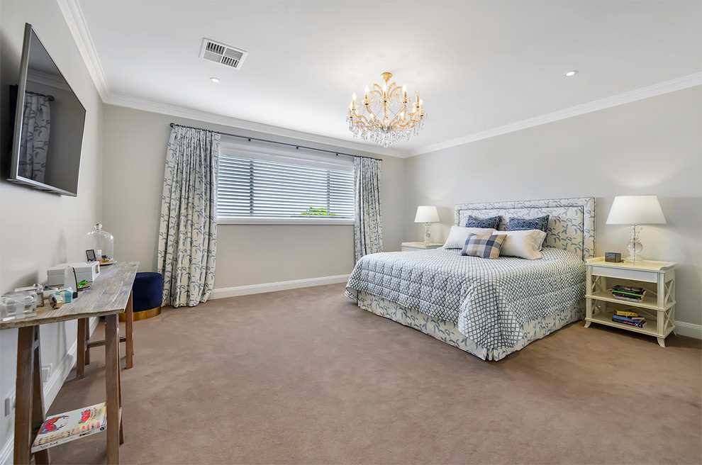 Design ideas for a large traditional bedroom in Sydney with beige walls, carpet and beige floor.