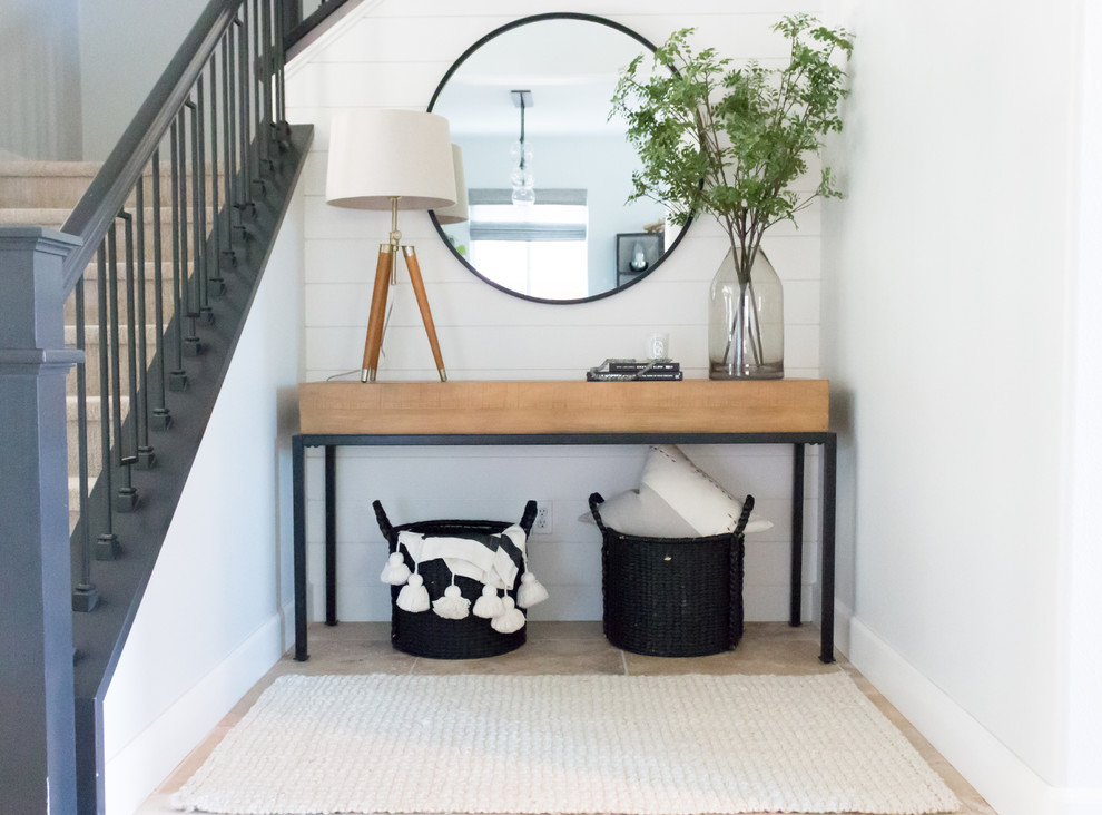 Modern entryway in Other with grey walls.