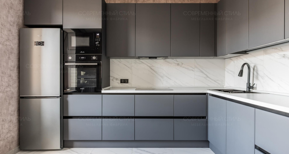 This is an example of a small contemporary grey and white l-shaped enclosed kitchen in Moscow with flat-panel cabinets, grey cabinets, white splashback, black appliances, no island and white worktops.