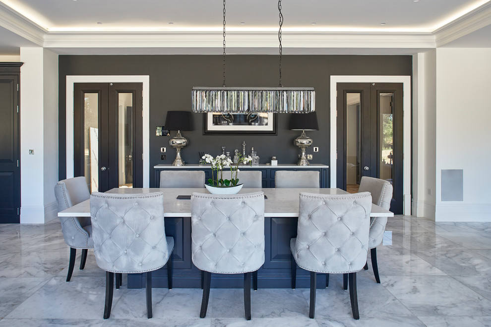 Traditional open plan dining in Other with white walls and grey floor.