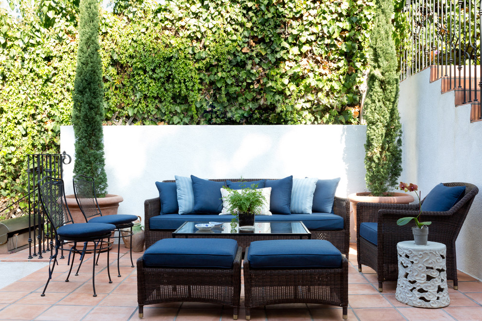 Design ideas for a mediterranean patio in Los Angeles with tile and no cover.