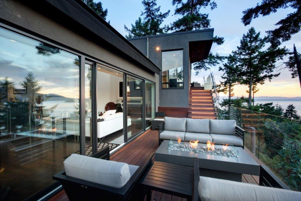 Mid-sized transitional backyard deck photo in Calgary with no cover