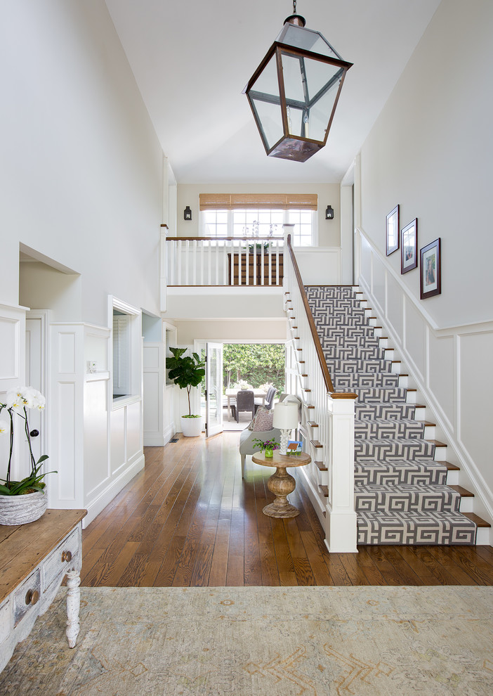 Large transitional wood straight staircase in Los Angeles.