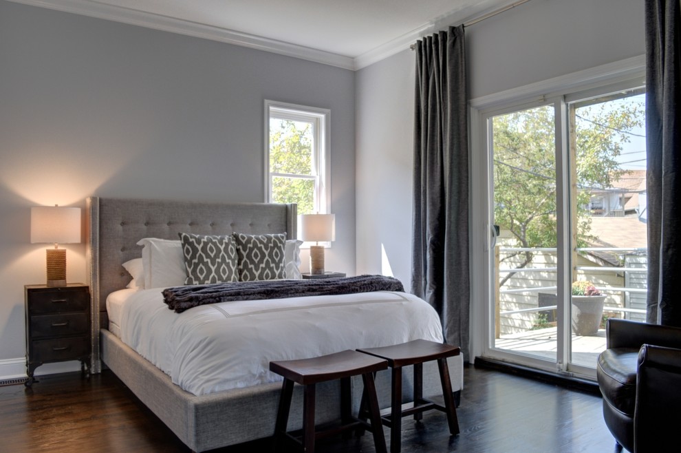 Mid-sized contemporary master bedroom in Chicago with grey walls and dark hardwood floors.
