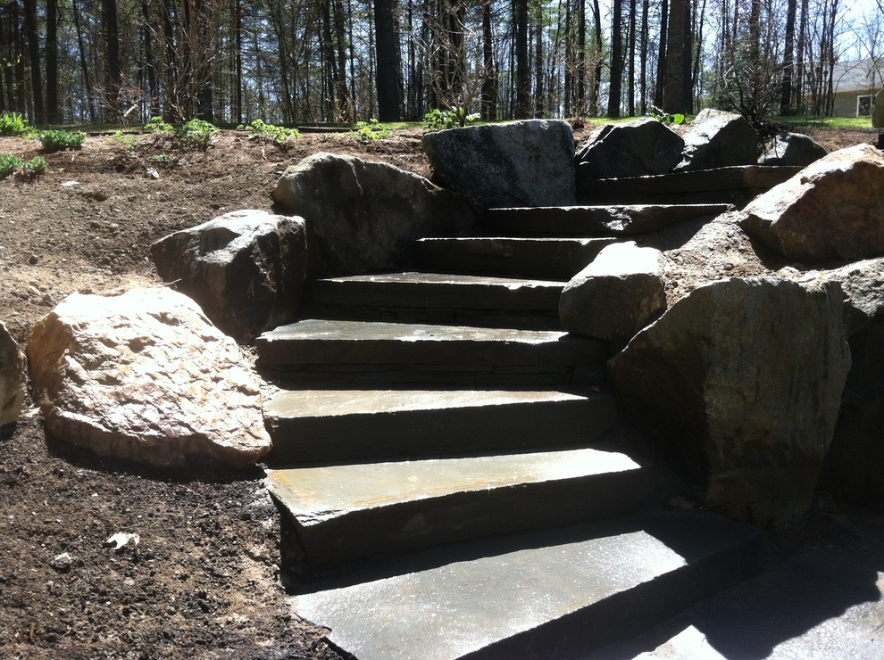 Inspiration for a rustic backyard landscaping in Manchester.