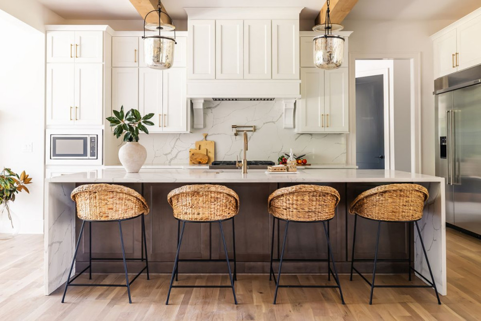 Example of a transitional kitchen design in Atlanta with an island