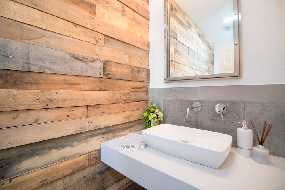 Example of a beach style gray tile bathroom design in Orange County with white walls, a vessel sink and white countertops