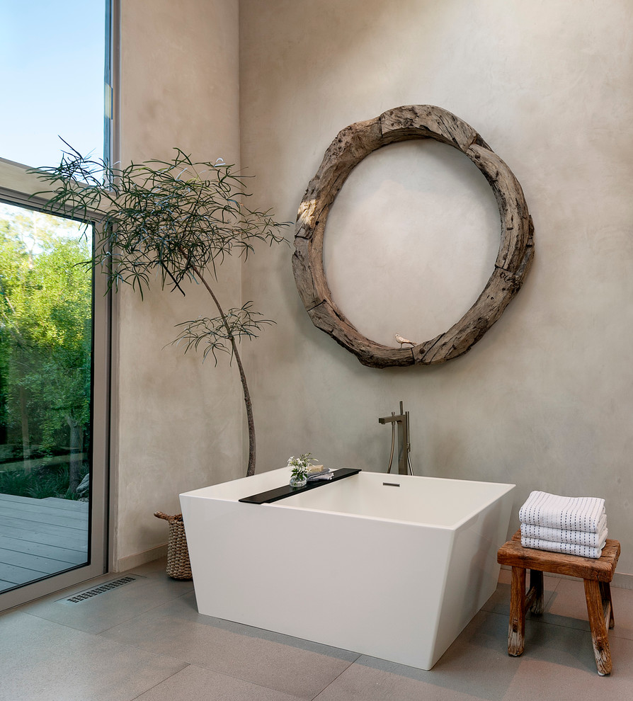 Inspiration for an expansive contemporary master bathroom in Santa Barbara with flat-panel cabinets, grey cabinets, a freestanding tub, an open shower, grey walls, an integrated sink, porcelain floors and engineered quartz benchtops.