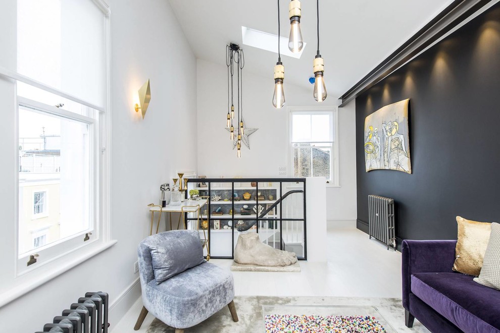 Inspiration for a large bohemian mezzanine living room in London with white walls, a built-in media unit and white floors.