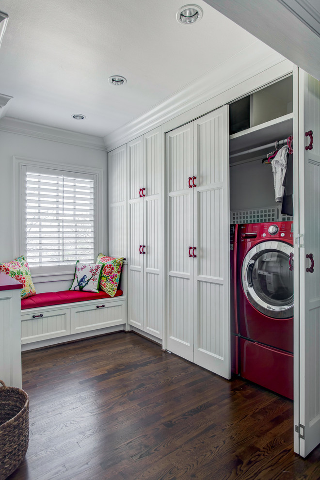 This is an example of a country u-shaped laundry room in Dallas with recessed-panel cabinets, white cabinets, medium hardwood floors and red benchtop.