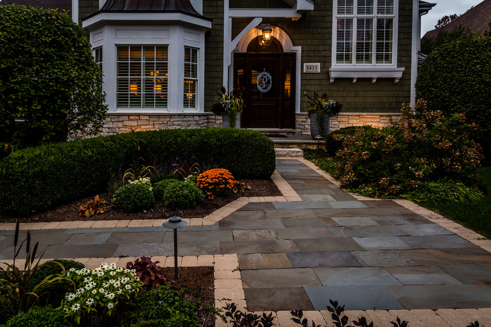 Inspiration for a mid-sized traditional front door in Chicago with a single front door and a dark wood front door.